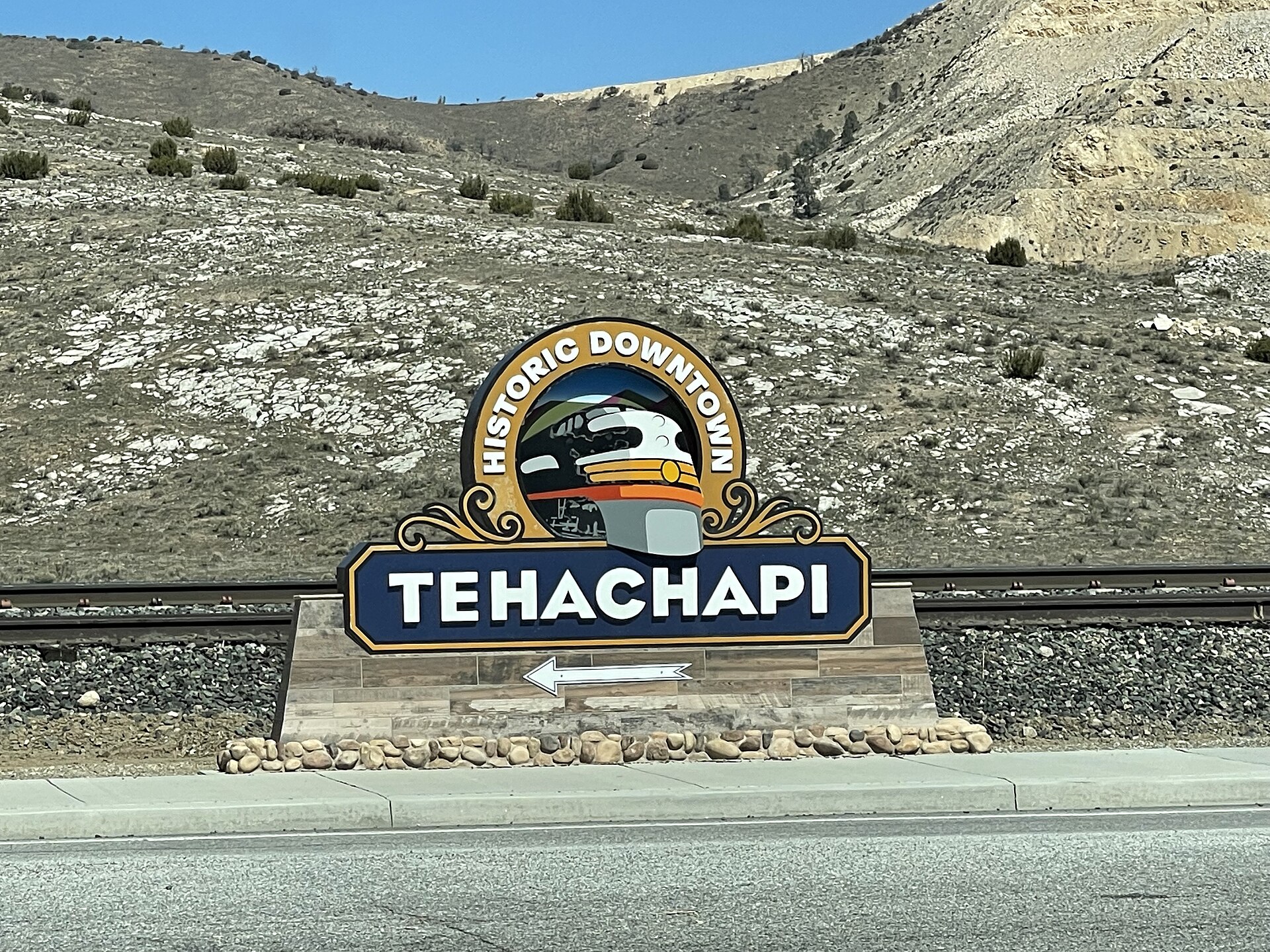 Historic Downtown Tehachapi sign beside the railroad tracks